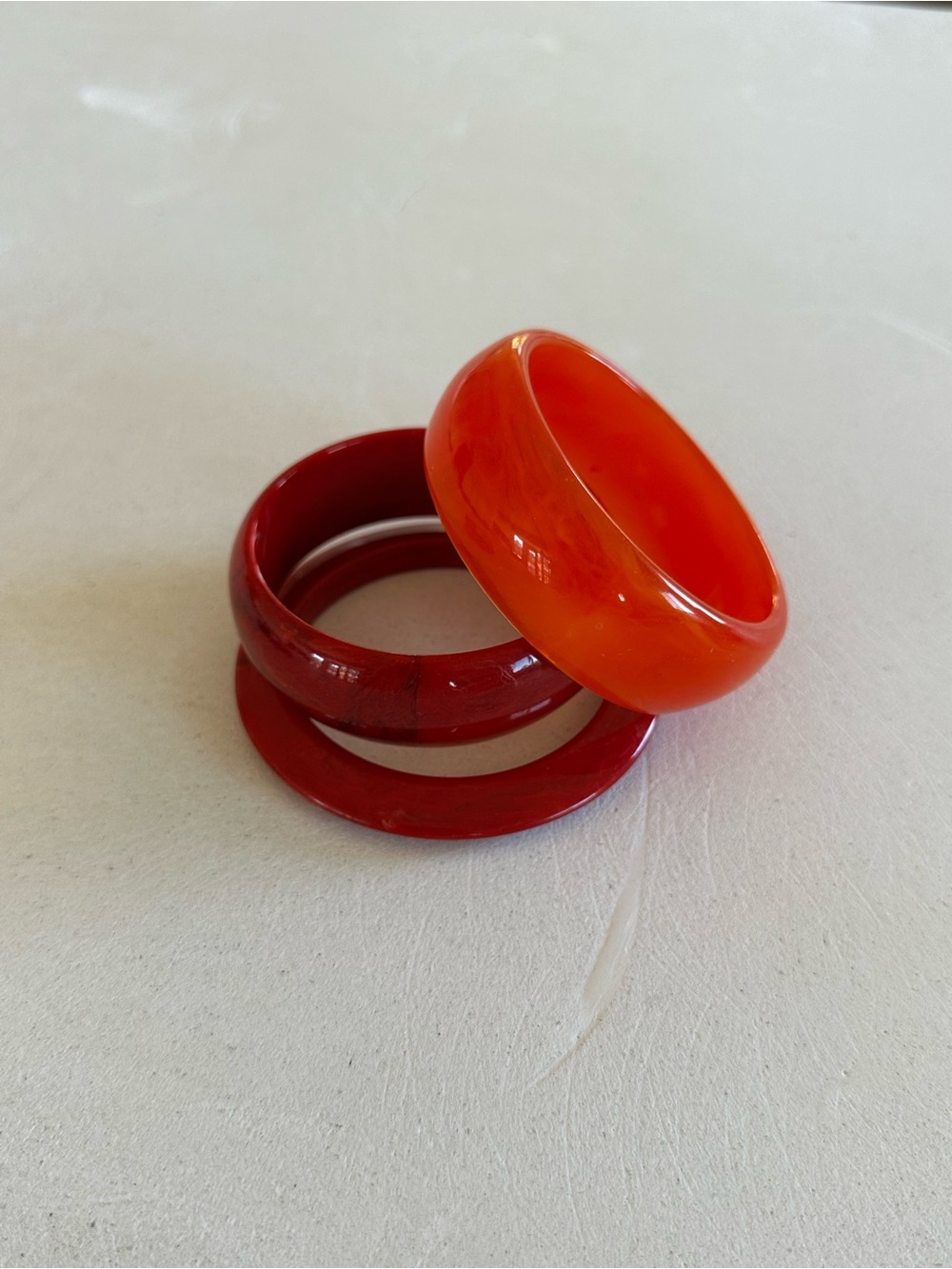 bebe Orange and Deep Red Resin Bangle Trio